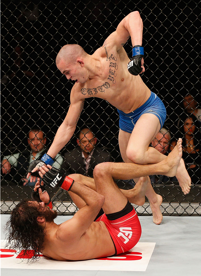 MEXICO CITY, MEXICO - NOVEMBER 15: (Top) Marlon Vera punches Marco Beltra in their bantamweight bout during the UFC 180 event at Arena Ciudad de Mexico on November 15, 2014 in Mexico City, Mexico. (Photo by Josh Hedges/Zuffa LLC/Zuffa LLC via Getty Imag