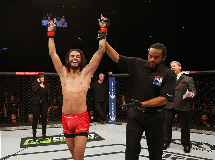 MEXICO CITY, MEXICO - NOVEMBER 15: Marco Beltra celebrates his victory over Marlon Vera in their bantamweight bout during the UFC 180 event at Arena Ciudad de Mexico on November 15, 2014 in Mexico City, Mexico. (Photo by Josh Hedges/Zuffa LLC/Zuffa LLC vi