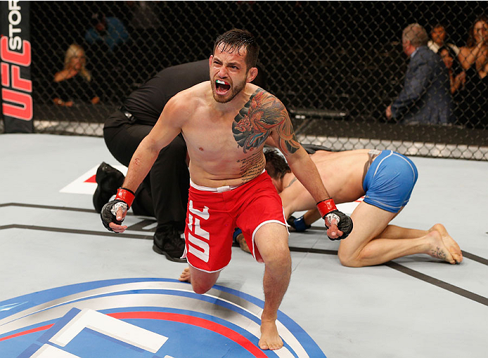 MEXICO CITY, MEXICO - NOVEMBER 15: Henry Briones celebrates after submitting Guido Cannetti in their bantamweight bout during the UFC 180 event at Arena Ciudad de Mexico on November 15, 2014 in Mexico City, Mexico. (Photo by Josh Hedges/Zuffa LLC/Zuffa