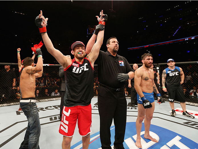 MEXICO CITY, MEXICO - NOVEMBER 15: Henry Briones celebrates after submitting Guido Cannetti in their bantamweight bout during the UFC 180 event at Arena Ciudad de Mexico on November 15, 2014 in Mexico City, Mexico. (Photo by Josh Hedges/Zuffa LLC/Zuffa