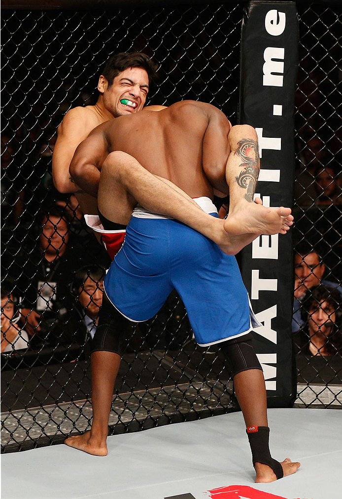 MEXICO CITY, MEXICO - NOVEMBER 15: (L-R) Gabriel Benitez attempts to submit Humberto Brown in their featherweight bout during the UFC 180 event at Arena Ciudad de Mexico on November 15, 2014 in Mexico City, Mexico. (Photo by Josh Hedges/Zuffa LLC/Zuffa