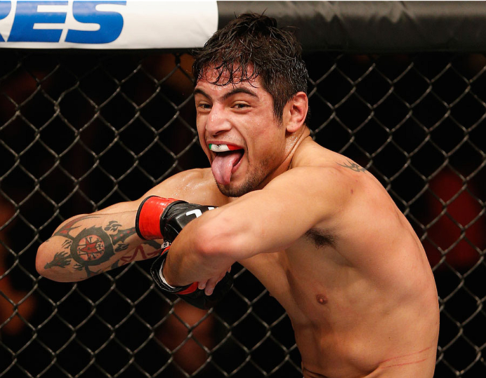 MEXICO CITY, MEXICO - NOVEMBER 15: Gabriel Benitez celebrates his submission victory over Humberto Brown in their featherweight bout during the UFC 180 event at Arena Ciudad de Mexico on November 15, 2014 in Mexico City, Mexico. (Photo by Josh Hedges/Zu