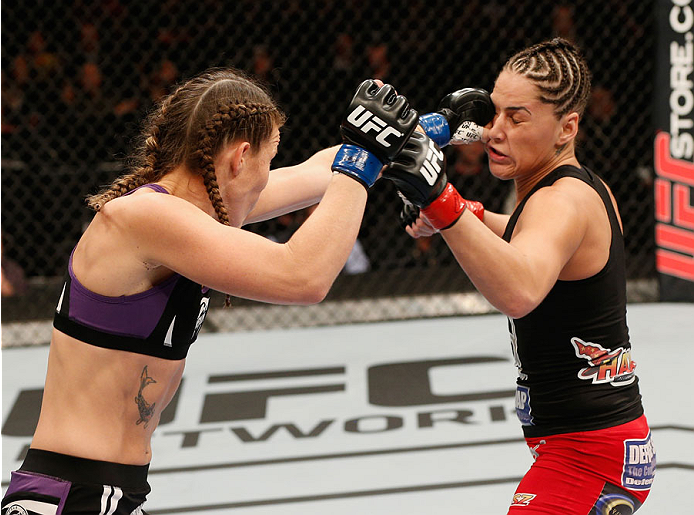 MEXICO CITY, MEXICO - NOVEMBER 15: (L-R) Leslie Smith punches Jessica Eye in their women's bantamweight bout during the UFC 180 event at Arena Ciudad de Mexico on November 15, 2014 in Mexico City, Mexico. (Photo by Josh Hedges/Zuffa LLC/Zuffa LLC via Ge