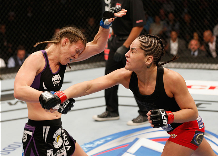 MEXICO CITY, MEXICO - NOVEMBER 15: (R-L) Jessica Eye punches Leslie Smith in their women's bantamweight bout during the UFC 180 event at Arena Ciudad de Mexico on November 15, 2014 in Mexico City, Mexico. (Photo by Josh Hedges/Zuffa LLC/Zuffa LLC via Ge