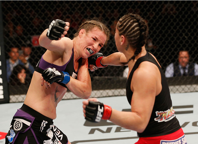 MEXICO CITY, MEXICO - NOVEMBER 15: (R-L) Jessica Eye punches Leslie Smith in their women's bantamweight bout during the UFC 180 event at Arena Ciudad de Mexico on November 15, 2014 in Mexico City, Mexico. (Photo by Josh Hedges/Zuffa LLC/Zuffa LLC via Ge