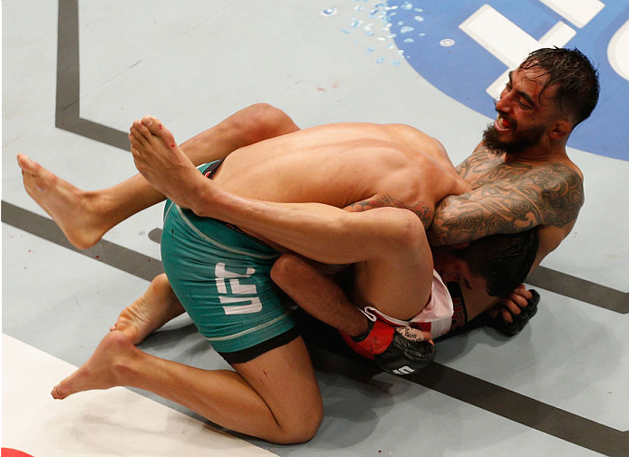 MEXICO CITY, MEXICO - NOVEMBER 15: Jose Quinonezattempts to submit Alejandro Perez in their bantamweight bout during the UFC 180 event at Arena Ciudad de Mexico on November 15, 2014 in Mexico City, Mexico. (Photo by Josh Hedges/Zuffa LLC/Zuffa LLC via G