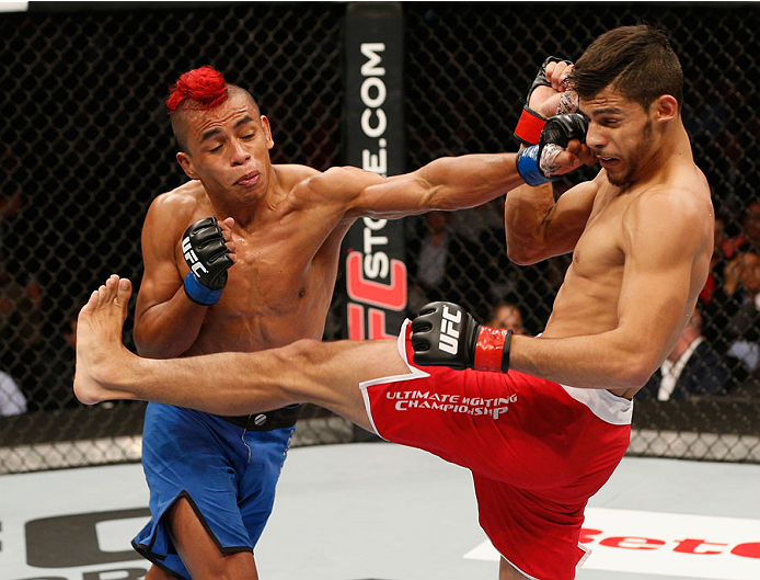 MEXICO CITY, MEXICO - NOVEMBER 15: (L-R) Leonardo Morales punches Yair Rodriguez in their featherweight bout during the UFC 180 event at Arena Ciudad de Mexico on November 15, 2014 in Mexico City, Mexico. (Photo by Josh Hedges/Zuffa LLC/Zuffa LLC via Ge