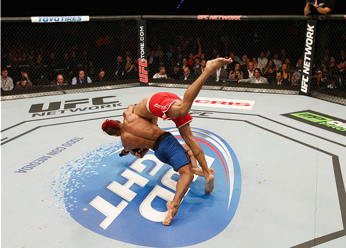 MEXICO CITY, MEXICO - NOVEMBER 15: (L-R) Leonardo Morales throws Yair Rodriguez onto the canvas in their featherweight bout during the UFC 180 event at Arena Ciudad de Mexico on November 15, 2014 in Mexico City, Mexico. (Photo by Josh Hedges/Zuffa LLC/Z