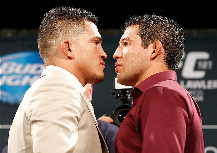 LAS VEGAS, NV - SEPTEMBER 26: (L-R) Opponents Anthony Pettis and Gilbert Melendez face off during the UFC 181 press conference at the MGM Grand Conference Center on September 26, 2014 in Las Vegas, Nevada. (Photo by Josh Hedges/Zuffa LLC/Zuffa LLC via Get