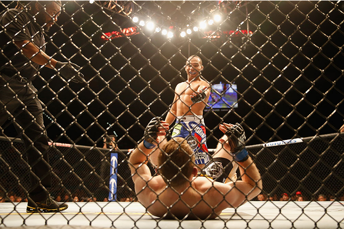 LAS VEGAS, NV - MAY 23: John Dodson waits for Zach Makovsky to stand up in their flyweight bout during the UFC 187 event at the MGM Grand Garden Arena on May 23, 2015 in Las Vegas, Nevada. (Photo by Christian Petersen/Zuffa LLC/Zuffa LLC via Getty Image