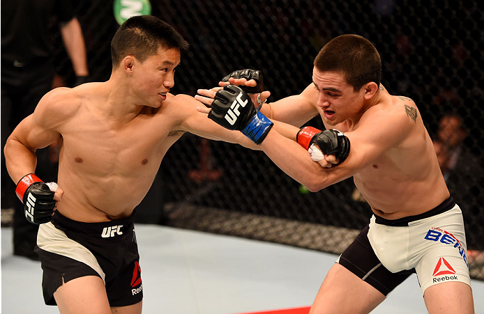 MELBOURNE, AUSTRALIA - NOVEMBER 15: (L-R) Ben Nguyen throws a punch against Ryan Benoit in the first round of their flyweight bout during the UFC 193 event at Etihad Stadium on November 15, 2015 in Melbourne, Australia. (Photo by Josh Hedges/Zuffa LLC/