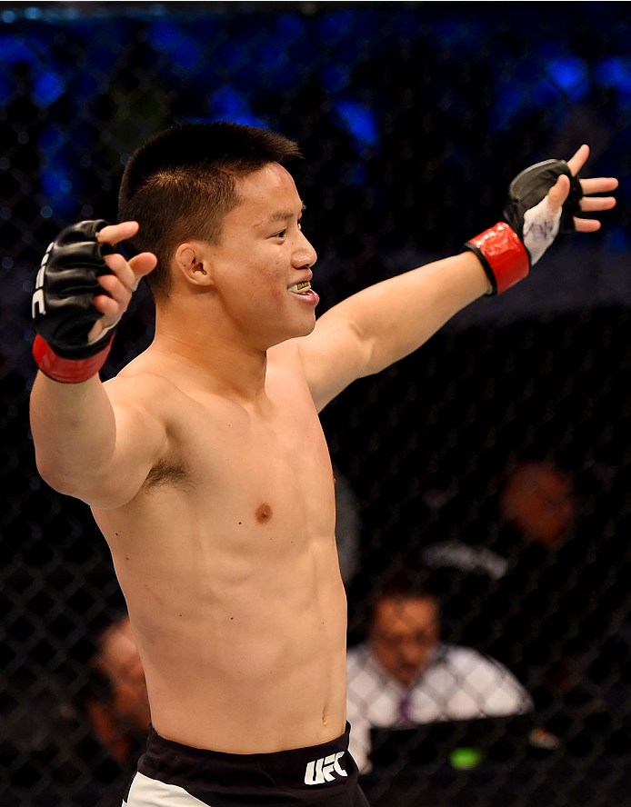 MELBOURNE, AUSTRALIA - NOVEMBER 15: Ben Nguyen celebrates his win by submission due to rear naked choke against Ryan Benoit (not pictured) in their flyweight bout during the UFC 193 event at Etihad Stadium on November 15, 2015 in Melbourne, Australia. (