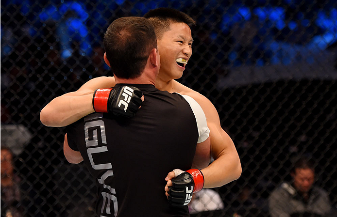 MELBOURNE, AUSTRALIA - NOVEMBER 15: Ben Nguyen celebrates his win by submission due to rear naked choke against Ryan Benoit (not pictured) in their flyweight bout during the UFC 193 event at Etihad Stadium on November 15, 2015 in Melbourne, Australia. (