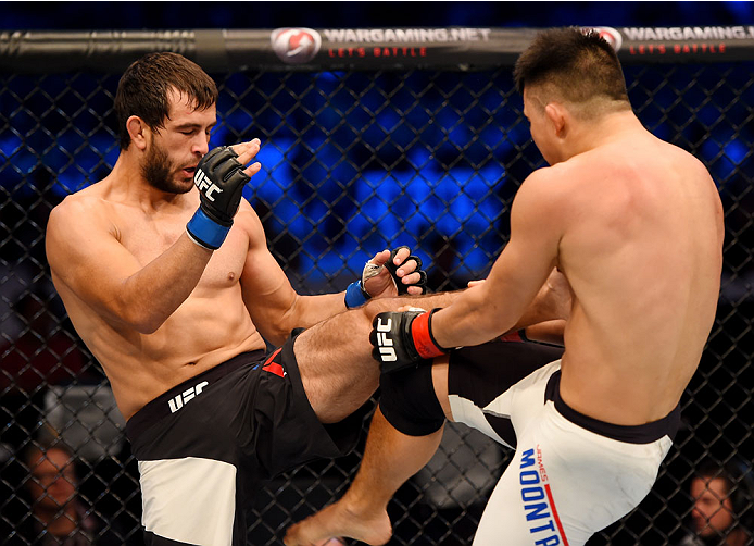 MELBOURNE, AUSTRALIA - NOVEMBER 15: (L-R) Anton Zafir performs a front kick against James Moontasri in the first round of their welterweight bout during the UFC 193 event at Etihad Stadium on November 15, 2015 in Melbourne, Australia. (Photo by Josh Hed