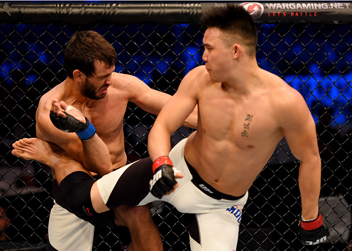 MELBOURNE, AUSTRALIA - NOVEMBER 15: James Moontasri (R) performs a spinning back kick to the abdomen of Anton Zafir (L) in round one of their welterweight bout during the UFC 193 event at Etihad Stadium on November 15, 2015 in Melbourne, Australia. (Pho