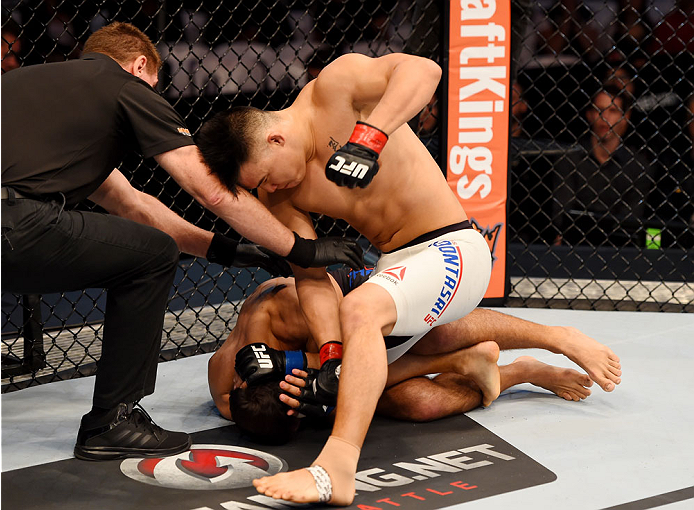 MELBOURNE, AUSTRALIA - NOVEMBER 15: James Moontasri (t) throws a punch against Anton Zafir (b) in round one of their welterweight bout during the UFC 193 event at Etihad Stadium on November 15, 2015 in Melbourne, Australia. (Photo by Josh Hedges/Zuffa L