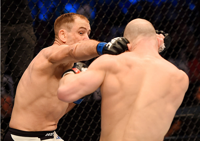 MELBOURNE, AUSTRALIA - NOVEMBER 15: (L-R) Steven Kennedy throws a punch against Richard Walsh in round one of their their welterweight bout during the UFC 193 event at Etihad Stadium on November 15, 2015 in Melbourne, Australia. (Photo by Josh Hedges/Zu