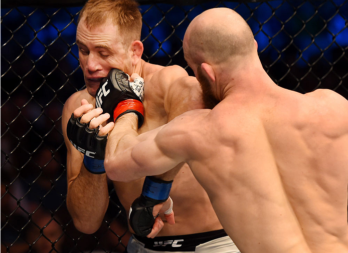 MELBOURNE, AUSTRALIA - NOVEMBER 15: Richard Walsh (R) lands a punch to the chin of Steven Kennedy in round one of their welterweight bout during the UFC 193 event at Etihad Stadium on November 15, 2015 in Melbourne, Australia. (Photo by Josh Hedges/Zuffa