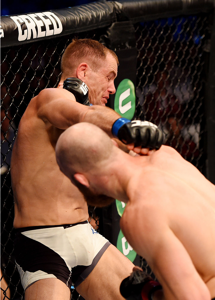 MELBOURNE, AUSTRALIA - NOVEMBER 15: (L-R) Steven Kennedy and Richard Walsh exchange punches in the third round of their welterweight bout during the UFC 193 event at Etihad Stadium on November 15, 2015 in Melbourne, Australia. (Photo by Josh Hedges/Zuff