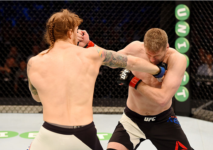 MELBOURNE, AUSTRALIA - NOVEMBER 15: Daniel Kelly (R) and Steve Montgomery (L) exchange punches in their middleweight bout during the UFC 193 event at Etihad Stadium on November 15, 2015 in Melbourne, Australia. (Photo by Josh Hedges/Zuffa LLC/Zuffa LLC