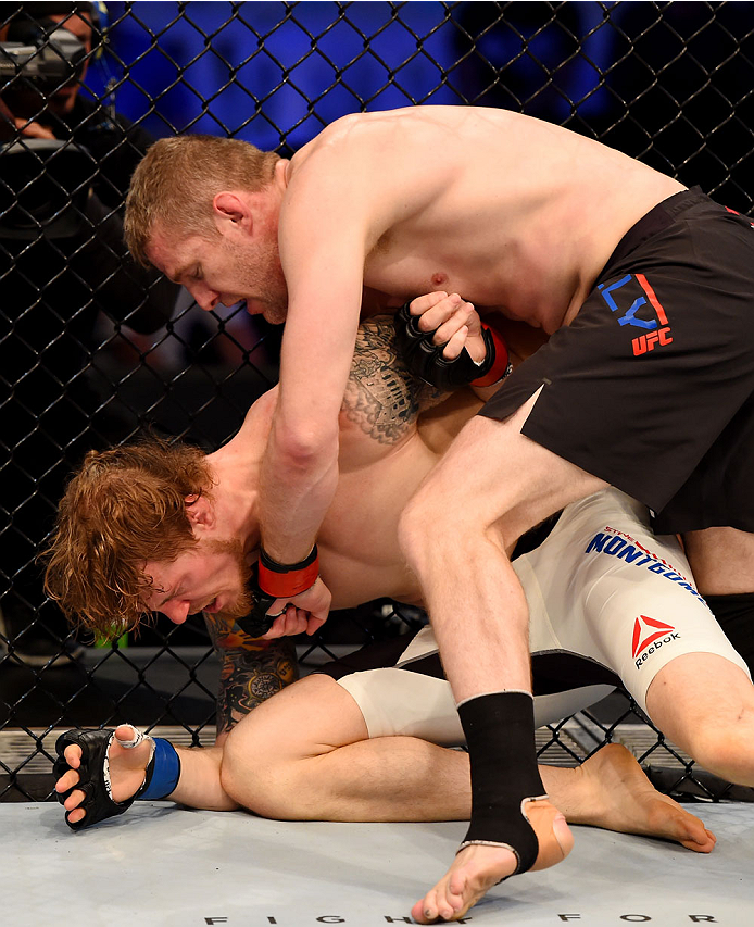 MELBOURNE, AUSTRALIA - NOVEMBER 15: Daniel Kelly (R) lands a left-handed punch against Steve Montgomery (L) in their middleweight bout during the UFC 193 event at Etihad Stadium on November 15, 2015 in Melbourne, Australia. (Photo by Josh Hedges/Zuffa L