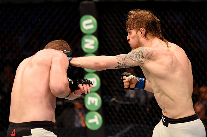 MELBOURNE, AUSTRALIA - NOVEMBER 15: Steve Montgomery (R) lands a left-handed punch against Daniel Kelly (L) in their middleweight bout during the UFC 193 event at Etihad Stadium on November 15, 2015 in Melbourne, Australia. (Photo by Josh Hedges/Zuffa LL