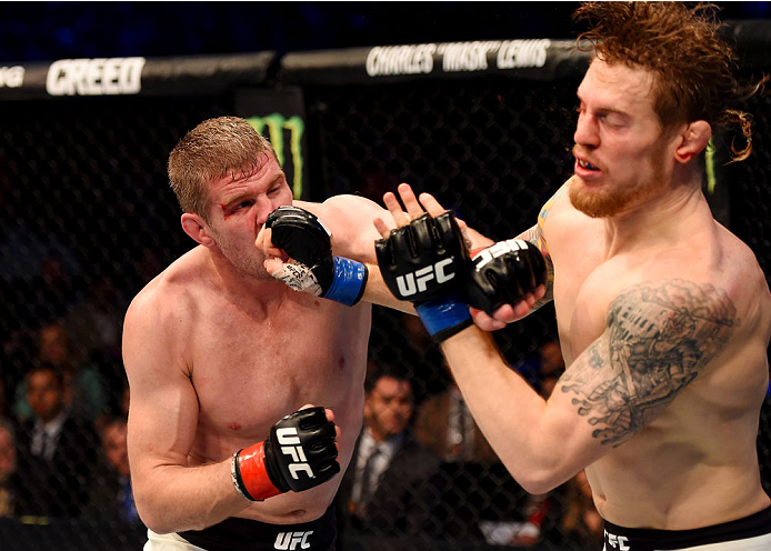 MELBOURNE, AUSTRALIA - NOVEMBER 15: Daniel Kelly (L) and Steve Montgomery (R) exchange punches in their middleweight bout during the UFC 193 event at Etihad Stadium on November 15, 2015 in Melbourne, Australia. (Photo by Josh Hedges/Zuffa LLC/Zuffa LLC