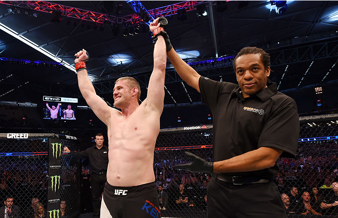 MELBOURNE, AUSTRALIA - NOVEMBER 15: Referee Herb Dean (C) announces Daniel Kelly (L) winner by unanimous decision against Steve Montgomery (R) after their middleweight bout during the UFC 193 event at Etihad Stadium on November 15, 2015 in Melbourne, Aus