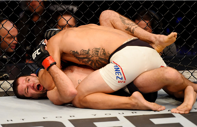 MELBOURNE, AUSTRALIA - NOVEMBER 15: (L-R) Danny Martinez works his offense from half-gaurd against Richie Vaculik in their flyweight bout during the UFC 193 event at Etihad Stadium on November 15, 2015 in Melbourne, Australia. (Photo by Josh Hedges/Zuff