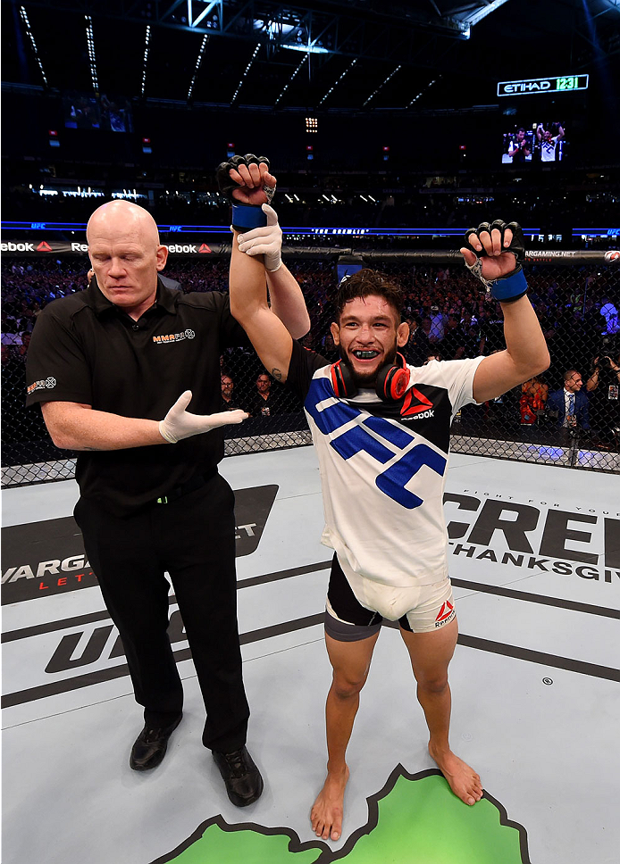 MELBOURNE, AUSTRALIA - NOVEMBER 15: Danny Martinez (R) is announced winner by unanimous decision against Richie Vaculik (not pictured) after their flyweight bout during the UFC 193 event at Etihad Stadium on November 15, 2015 in Melbourne, Australia. (P
