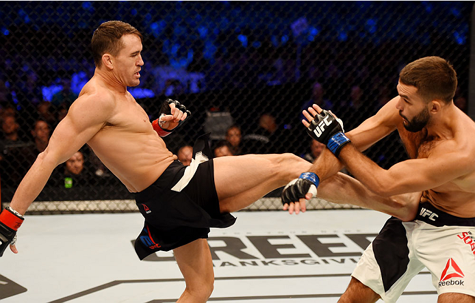 MELBOURNE, AUSTRALIA - NOVEMBER 15: Kyle Noke (L) lands a body kick against Peter Sobotta (R) in round one of their welterweight bout during the UFC 193 event at Etihad Stadium on November 15, 2015 in Melbourne, Australia. (Photo by Josh Hedges/Zuffa L