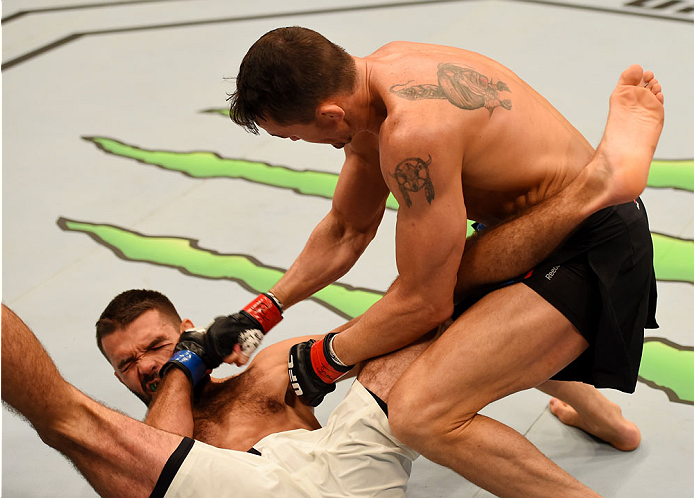 MELBOURNE, AUSTRALIA - NOVEMBER 15: Peter Sobotta (L) tries to defend himself as Kyle Noke (R) punches him in round one of their welterweight bout during the UFC 193 event at Etihad Stadium on November 15, 2015 in Melbourne, Australia. (Photo by Josh He