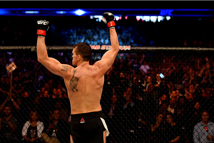 MELBOURNE, AUSTRALIA - NOVEMBER 15: Kyle Noke (L) celebrates his TKO (body kick and punches) against Peter Sobotta (not pictured) in round one of their welterweight bout during the UFC 193 event at Etihad Stadium on November 15, 2015 in Melbourne, Austra