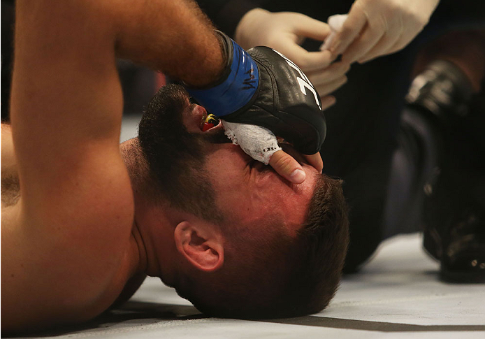 MELBOURNE, AUSTRALIA - NOVEMBER 15: Peter Sobotta of Poland receives treatment after being pinned down by Kyle Noke of Australia in their welterweight bout during the UFC 193 event at Etihad Stadium on November 15, 2015 in Melbourne, Australia. (Photo b