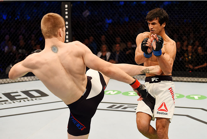 MELBOURNE, AUSTRALIA - NOVEMBER 15: Jake Matthews (L) kicks Akbarh Arreola (R) in their lightweight bout during the UFC 193 event at Etihad Stadium on November 15, 2015 in Melbourne, Australia. (Photo by Josh Hedges/Zuffa LLC/Zuffa LLC via Getty Images)