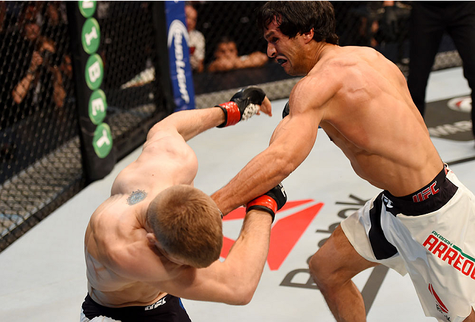 MELBOURNE, AUSTRALIA - NOVEMBER 15: Akbarh Arreola (R) throws a left-handed punch against Jake Matthews (L) in their lightweight bout during the UFC 193 event at Etihad Stadium on November 15, 2015 in Melbourne, Australia. (Photo by Josh Hedges/Zuffa LL