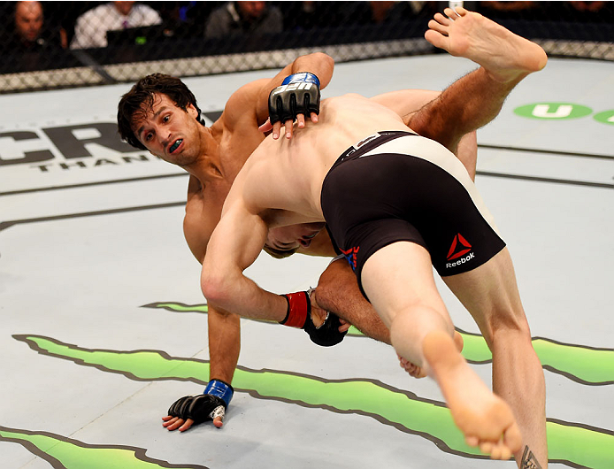 MELBOURNE, AUSTRALIA - NOVEMBER 15: Jake Matthews (R) takes down Akbarh Arreola (L) in their lightweight bout during the UFC 193 event at Etihad Stadium on November 15, 2015 in Melbourne, Australia. (Photo by Josh Hedges/Zuffa LLC/Zuffa LLC via Getty Im