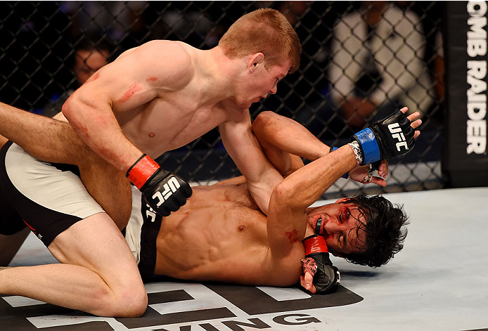 MELBOURNE, AUSTRALIA - NOVEMBER 15: Jake Matthews (L) lands a left-handed punch against Akbarh Arreola (R) in their lightweight bout during the UFC 193 event at Etihad Stadium on November 15, 2015 in Melbourne, Australia. (Photo by Josh Hedges/Zuffa LLC
