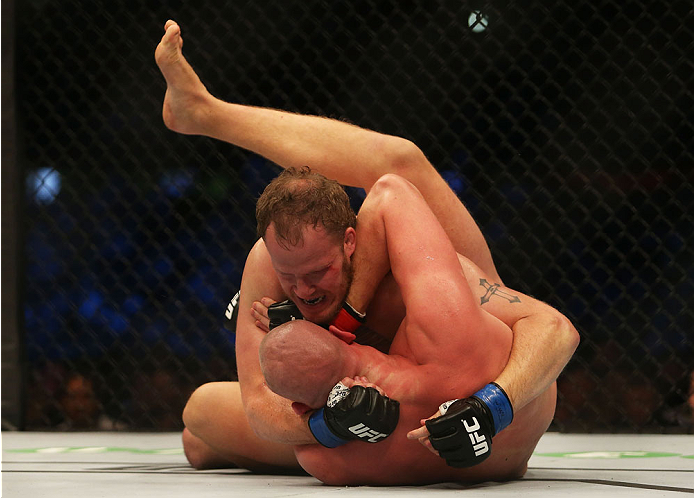 MELBOURNE, AUSTRALIA - NOVEMBER 15: Jared Rosholt of the United States pins down Stefan Struve of the Netherlands in their heavyweight bout during the UFC 193 event at Etihad Stadium on November 15, 2015 in Melbourne, Australia. (Photo by Pat Scala /Zuf