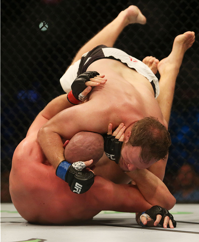 MELBOURNE, AUSTRALIA - NOVEMBER 15: Jared Rosholt of the United States pins down Stefan Struve of the Netherlands in their heavyweight bout during the UFC 193 event at Etihad Stadium on November 15, 2015 in Melbourne, Australia. (Photo by Pat Scala /Zuf