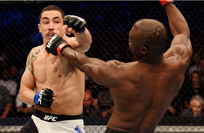 MELBOURNE, AUSTRALIA - NOVEMBER 15: (L-R) Robert Whittaker throws a left-handed punch against Uriah Hall in their middleweight bout during the UFC 193 event at Etihad Stadium on November 15, 2015 in Melbourne, Australia. (Photo by Josh Hedges/Zuffa LLC/