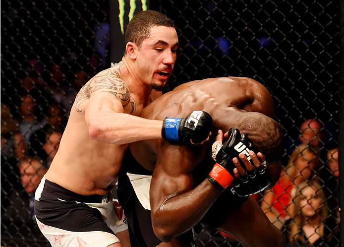 MELBOURNE, AUSTRALIA - NOVEMBER 15: (L-R) Robert Whittaker punches Uriah Hall in their middleweight bout during the UFC 193 event at Etihad Stadium on November 15, 2015 in Melbourne, Australia. (Photo by Josh Hedges/Zuffa LLC/Zuffa LLC via Getty Images)