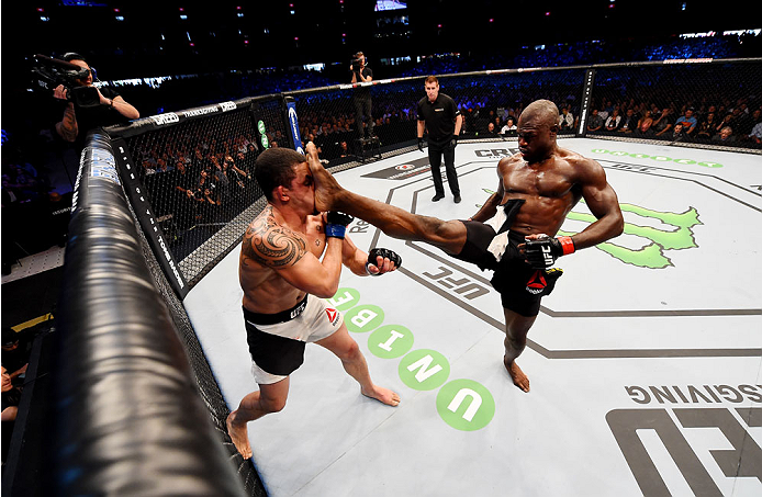 MELBOURNE, AUSTRALIA - NOVEMBER 15: Uriah Hall (R) throws a front kick to the face of Robert Whittaker (L) in their middleweight bout during the UFC 193 event at Etihad Stadium on November 15, 2015 in Melbourne, Australia. (Photo by Josh Hedges/Zuffa LL
