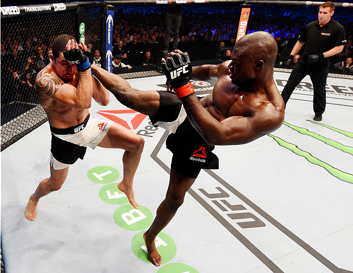 MELBOURNE, AUSTRALIA - NOVEMBER 15: Uriah Hall (R) throws a front kick to the face of Robert Whittaker (L) in their middleweight bout during the UFC 193 event at Etihad Stadium on November 15, 2015 in Melbourne, Australia. (Photo by Josh Hedges/Zuffa LL