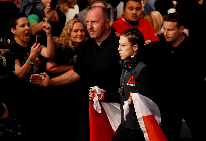 MELBOURNE, AUSTRALIA - NOVEMBER 15: Joanna Jedrzejczyk walks to the Octagon before facing Valerie Letourneau (not pictured) in their UFC women's strawweight championship bout during the UFC 193 event at Etihad Stadium on November 15, 2015 in Melbourne, Au