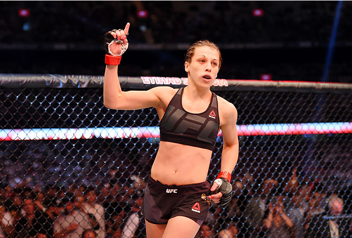MELBOURNE, AUSTRALIA - NOVEMBER 15: Joanna Jedrzejczyk holds up one finger from the Octagon before facing Valerie Letourneau (not pictured) in their UFC women's strawweight championship bout during the UFC 193 event at Etihad Stadium on November 15, 2015