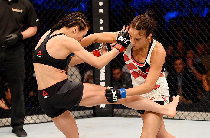 MELBOURNE, AUSTRALIA - NOVEMBER 15: (L-R) Joanna Jedrzejczyk kicks Valerie Letourneau in their UFC women's strawweight championship bout during the UFC 193 event at Etihad Stadium on November 15, 2015 in Melbourne, Australia. (Photo by Josh Hedges/Zuffa