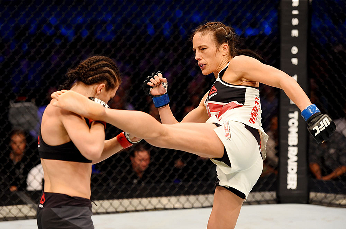MELBOURNE, AUSTRALIA - NOVEMBER 15: Valerie Letourneau (R) lands a left-leg kick against Joanna Jedrzejczyk (L) in their UFC women's strawweight championship bout during the UFC 193 event at Etihad Stadium on November 15, 2015 in Melbourne, Australia. (