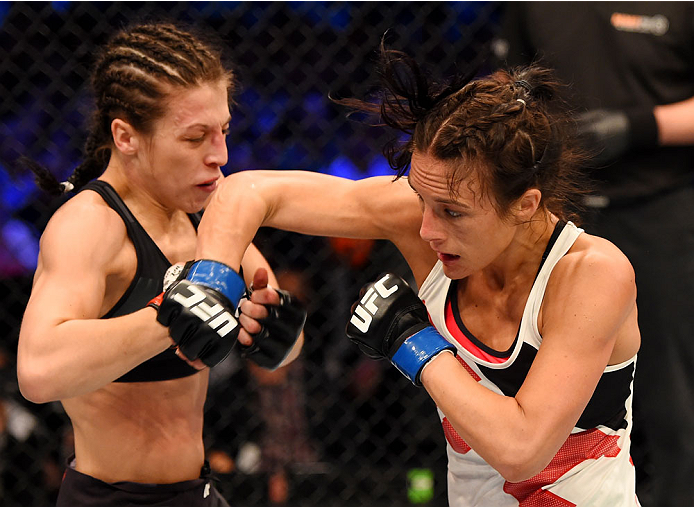 MELBOURNE, AUSTRALIA - NOVEMBER 15: Valerie Letourneau (R) throws an elbow against Joanna Jedrzejczyk (L) in their UFC women's strawweight championship bout during the UFC 193 event at Etihad Stadium on November 15, 2015 in Melbourne, Australia. (Photo