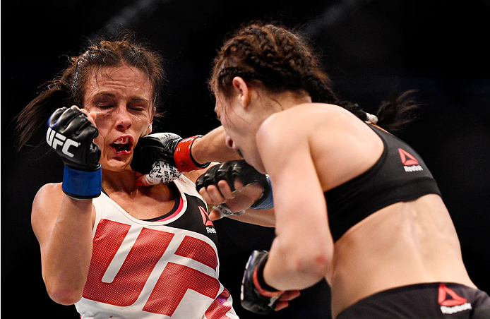 MELBOURNE, AUSTRALIA - NOVEMBER 15: Joanna Jedrzejczyk (R) lands a right-handed punch against Valerie Letourneau (L) in their UFC women's strawweight championship bout during the UFC 193 event at Etihad Stadium on November 15, 2015 in Melbourne, Australi